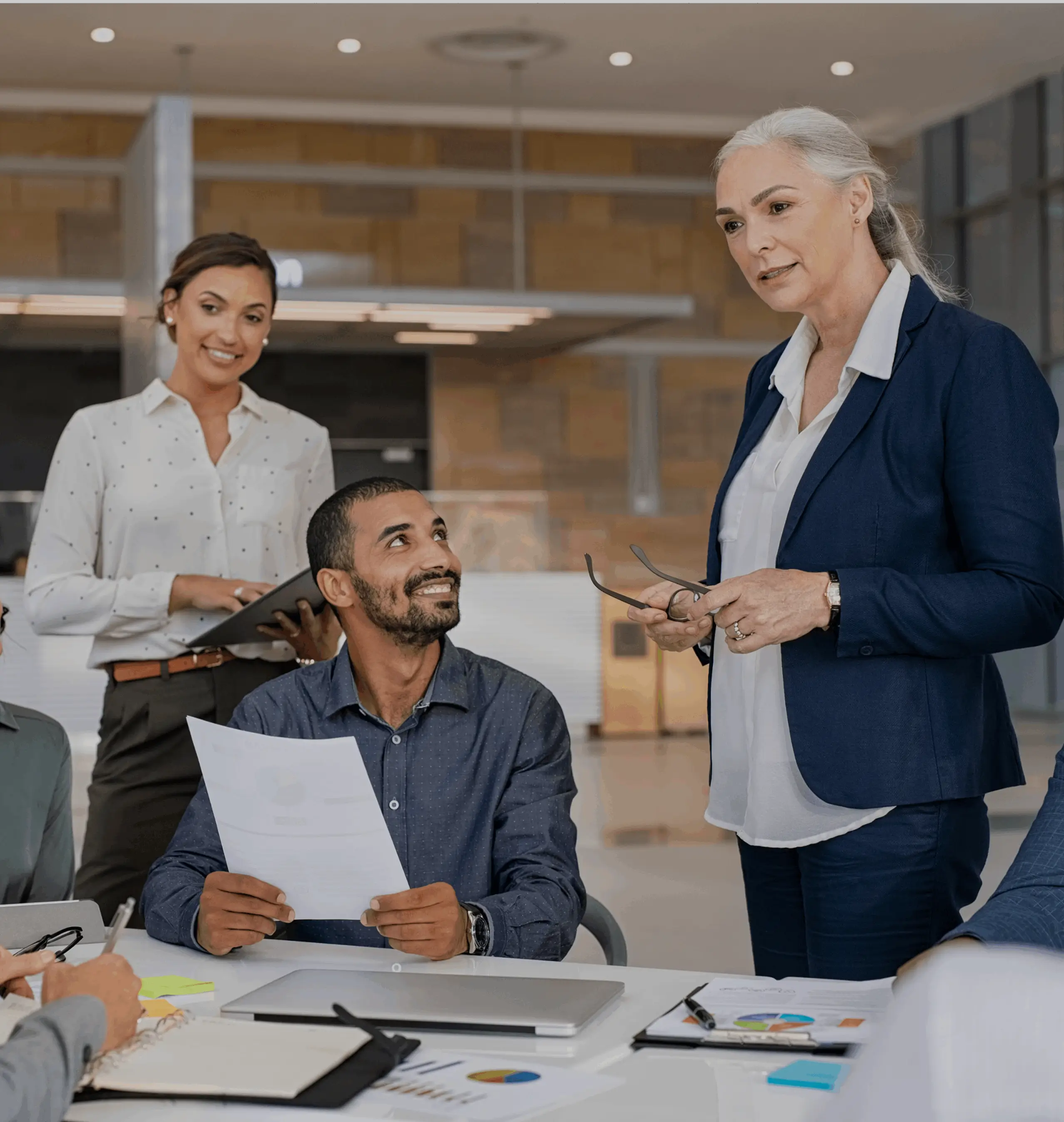 Business team collaborating in a modern office setting.